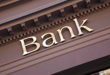 "Bank sign on building facade."