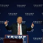 Man giving thumbs up at Trump Pence rally.