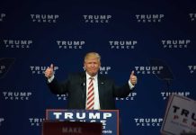 Man giving thumbs up at Trump Pence rally.