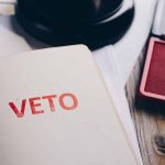 Closeup of "Veto" stamp on document page.