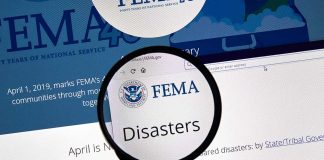 Magnifying glass over FEMA Disasters webpage.