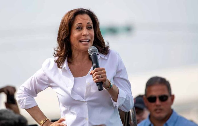 Woman speaking into microphone at outdoor event.