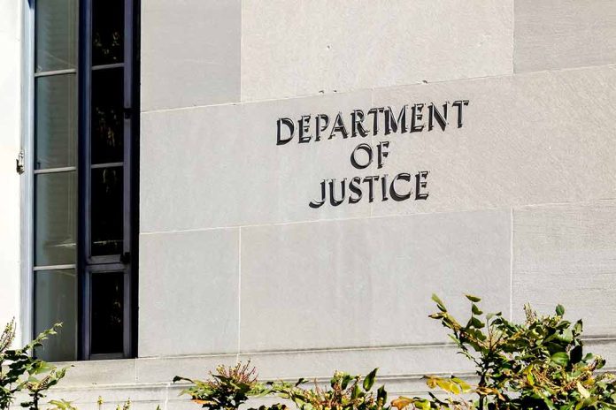 Department of Justice building exterior with window and plants.