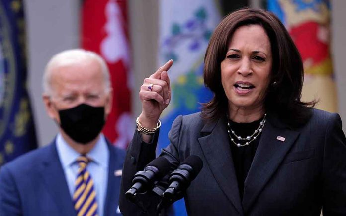 Woman speaking at podium, man with mask behind.