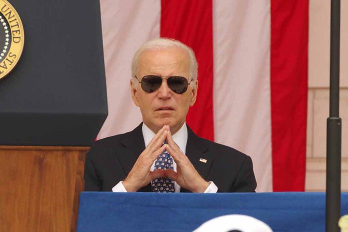 Man in sunglasses in front of American flag.