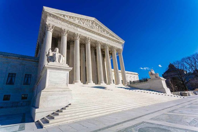 Supreme Court building with steps and statues.