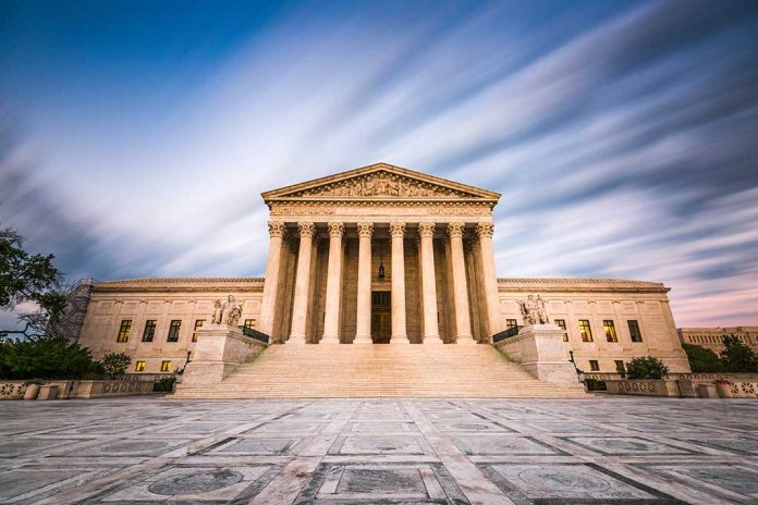 Historic building with columns under a dynamic sky.