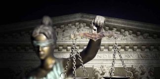 Blindfolded Lady Justice with scales, Supreme Court background.