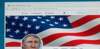 Twitter profile page with American flag banner.