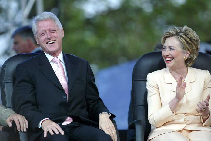 Two people sitting and laughing joyfully together.