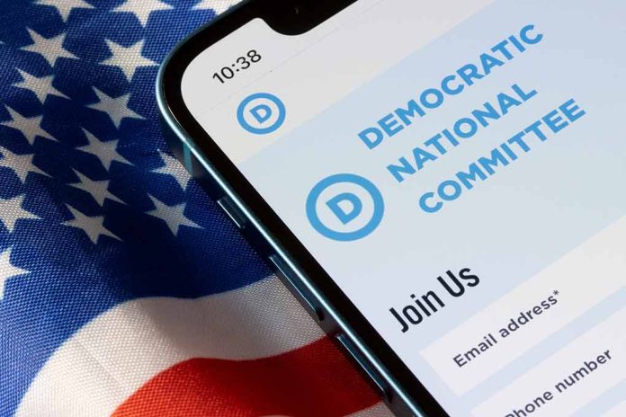 Phone displaying Democratic National Committee website over flag.