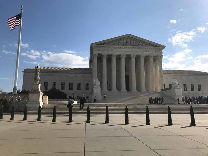 Supreme Court building with flag and people outside.