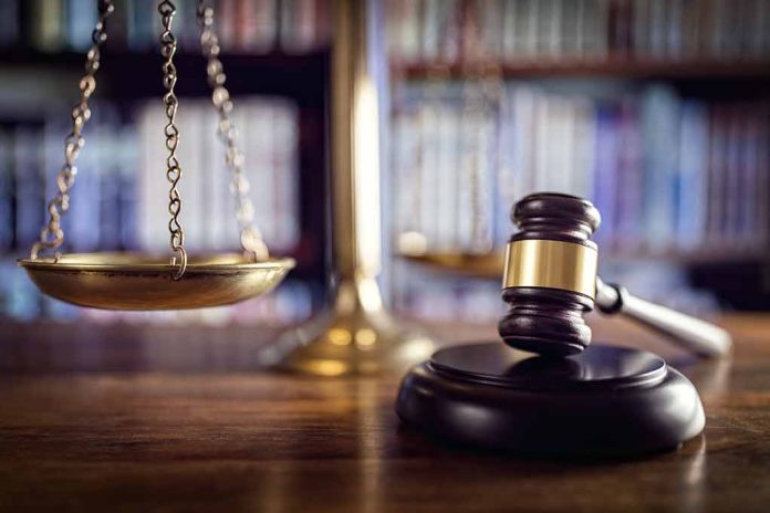 Gavel and scales of justice on desk.