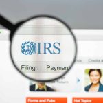 Magnifying glass over IRS website page