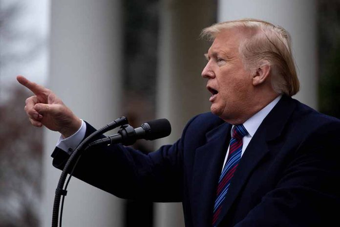 Man gesturing while speaking at a podium outside