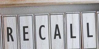 The word "RECALL" on wooden tiles.