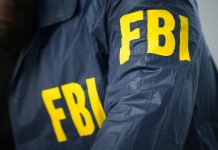 FBI agent wearing a jacket with yellow letters.