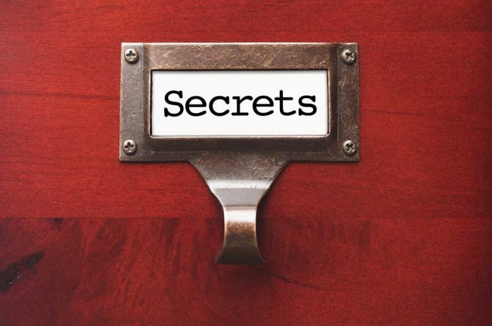 Label holder with the word "Secrets" on red background.