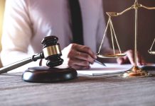 Gavel and scales of justice on desk.