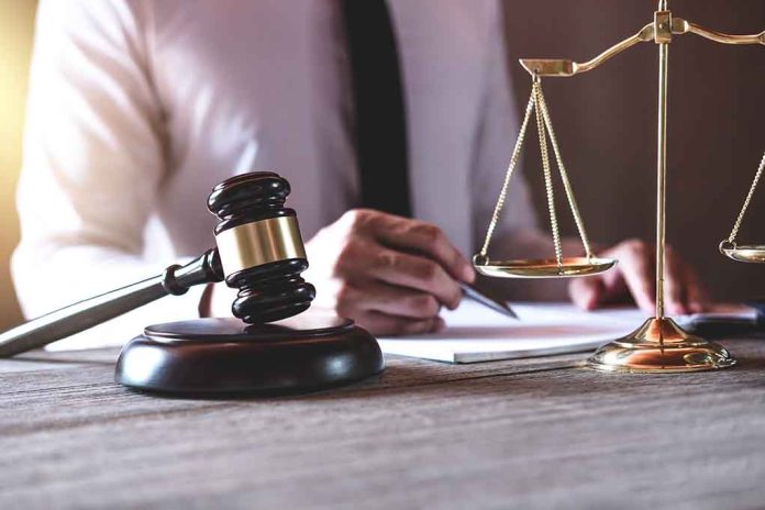 Gavel and scales of justice on desk.