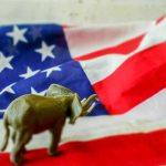 Elephant figure on American flag background