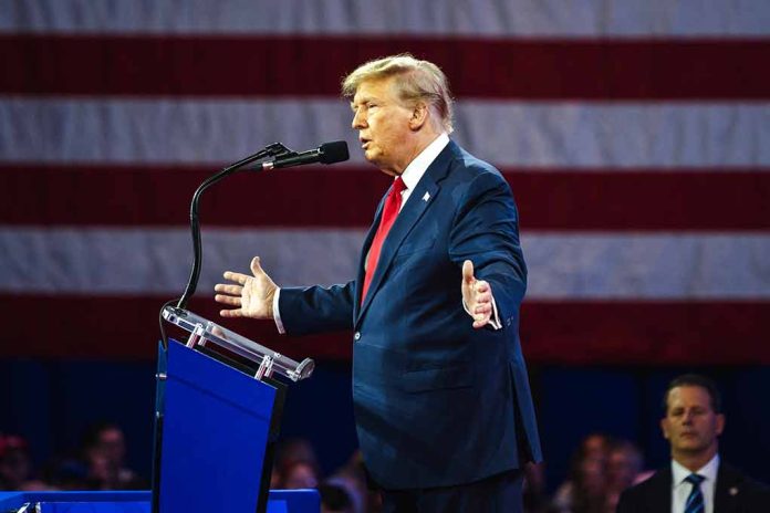 Person speaking at a podium with flag background.