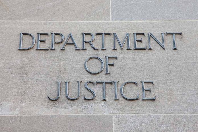 Department of Justice sign on building wall.