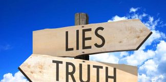 Signs pointing to "Lies" and "Truth" against sky.