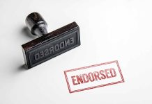 Rubber stamp with "ENDORSED" text on paper.