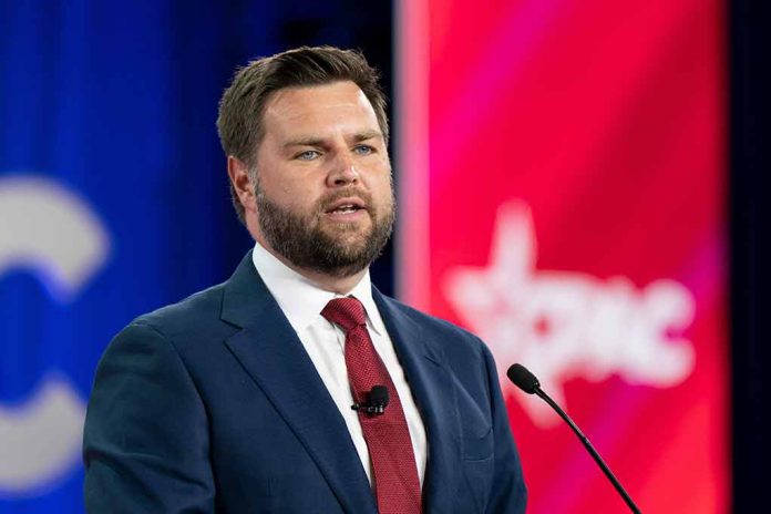 Man in suit speaking at a conference podium.