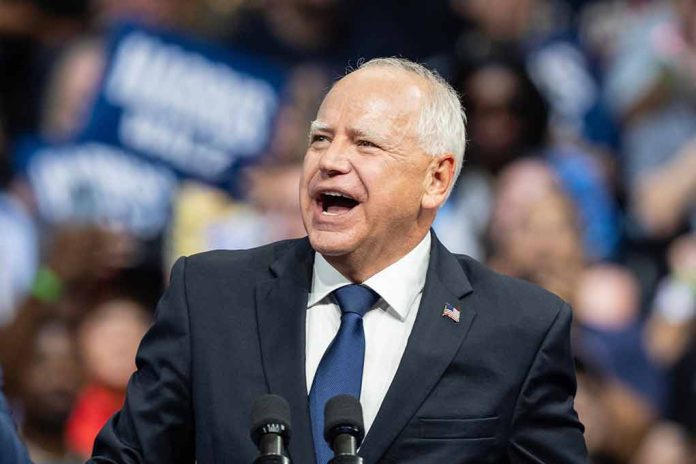 Man speaking at a crowded event.