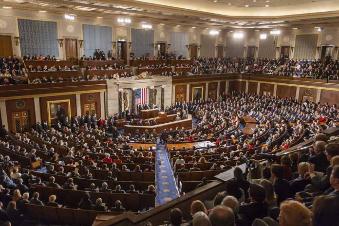 Audience in a large hall with central podium