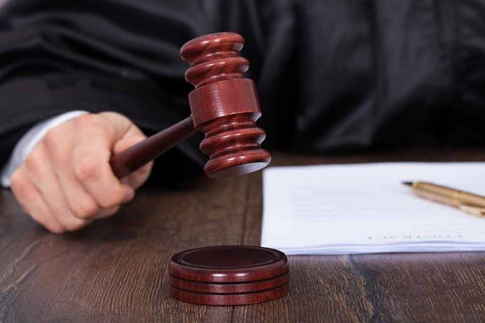 186812807 featured image Judge holding a gavel in courtroom setting