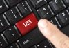 Finger pressing LIES key on keyboard.