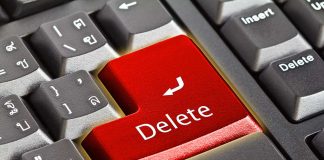 Close-up of a keyboard with red Delete key
