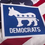 Democrats logo with donkey on American flag background