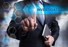 Man in suit pointing at Investigations text