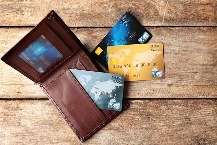 465382001 featured image Wallet with three credit cards on wooden surface