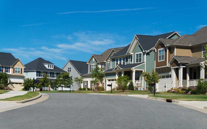 470746946 featured image Suburban street with colorful, modern houses.