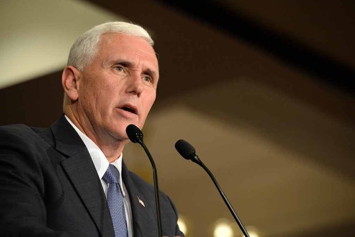 479350555 featured image Man in a suit speaking at a podium.