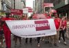 Group holding IMMIGRATION EQUALITY banner at a parade