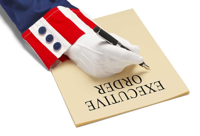 565895674 featured image Hand writing executive order on paper