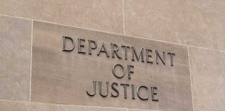 Department of Justice sign on a building.