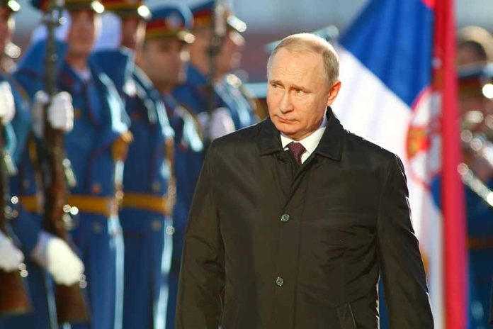 83211922 featured image A man in dark coat at a military event