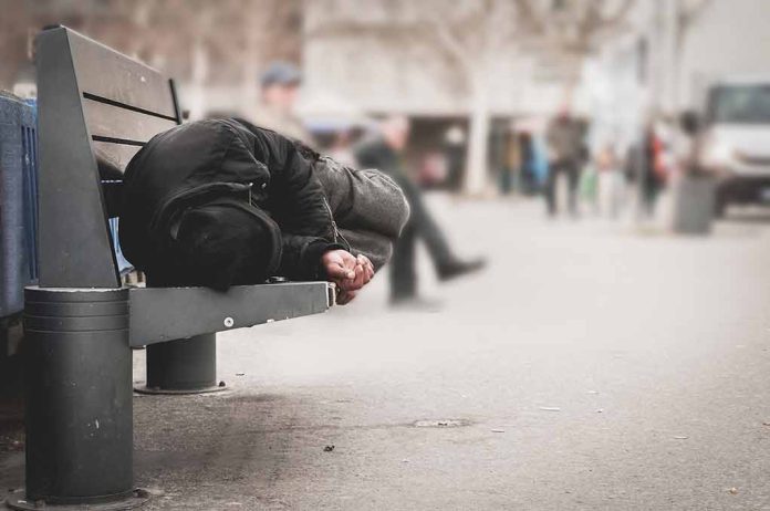 Person sleeping on a bench in a public area