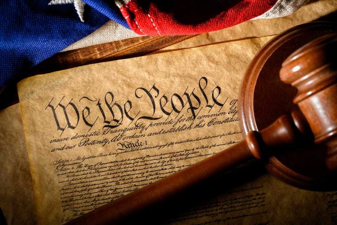 1650343750 featured image Gavel on U.S. Constitution with flag backdrop