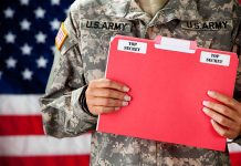 Soldier holding red top secret file folder