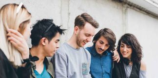 Group of friends looking at a smartphone