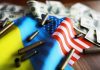 Flags bullet casings and dollar bills on table