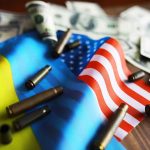 Flags bullet casings and dollar bills on table